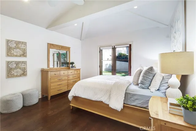 a bathroom with a granite countertop sink a toilet a mirror and shower