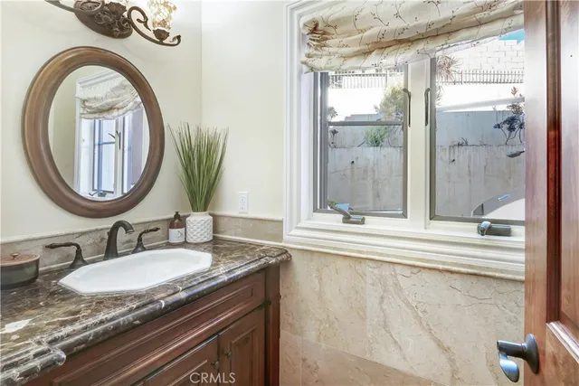 an aerial view of a house with a ocean