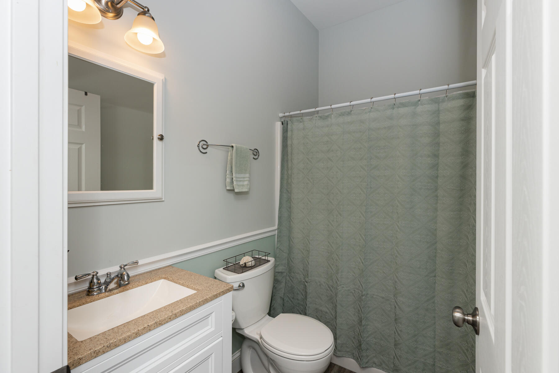 5 Whiffletree Circle Sandwich, MA 02563 - Photo 17 of 33 a white toilet sitting next to a bathroom sink