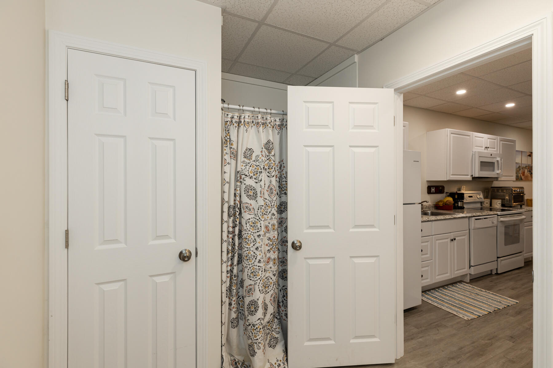 5 Whiffletree Circle Sandwich, MA 02563 - Photo 23 of 33 a kitchen with white cabinets and white appliances