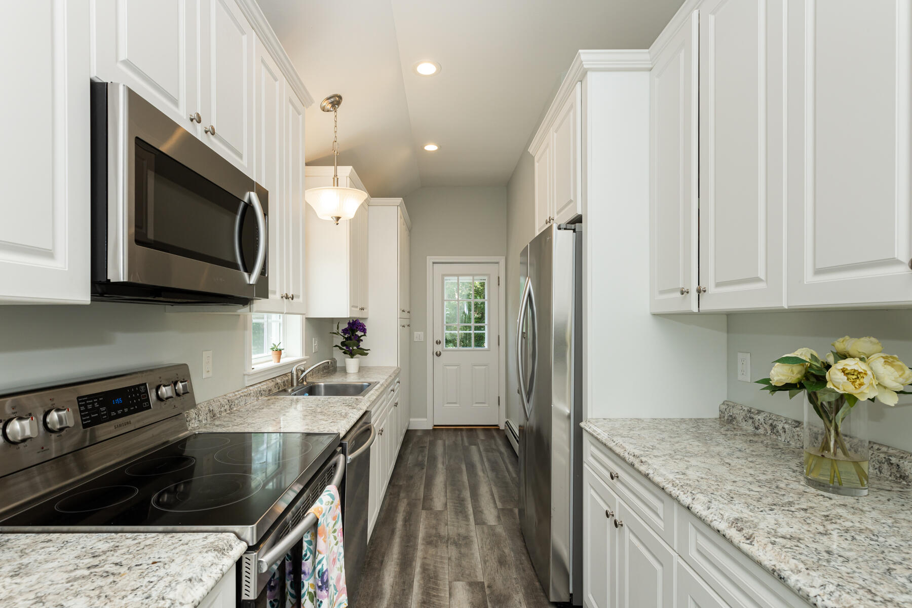 5 Whiffletree Circle Sandwich, MA 02563 - Photo 3 of 33 a kitchen with granite countertop a sink a stove top oven and cabinetry
