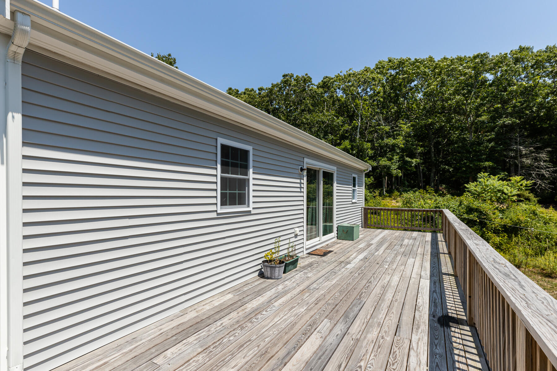 5 Whiffletree Circle Sandwich, MA 02563 - Photo 31 of 33 a balcony with wooden floor and yard in the back