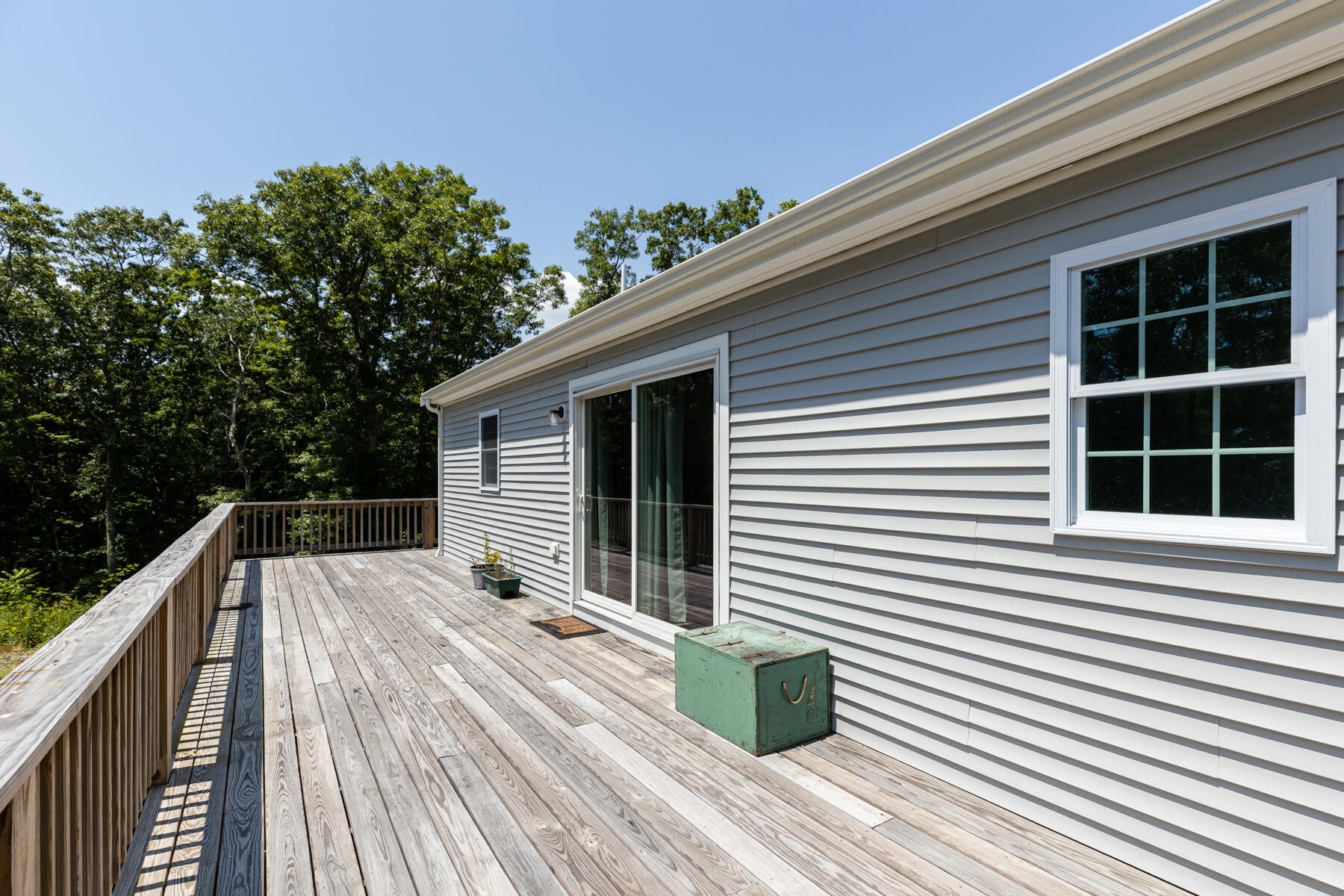 5 Whiffletree Circle Sandwich, MA 02563 - Photo 32 of 33 a backyard of a house with wooden floor and fence