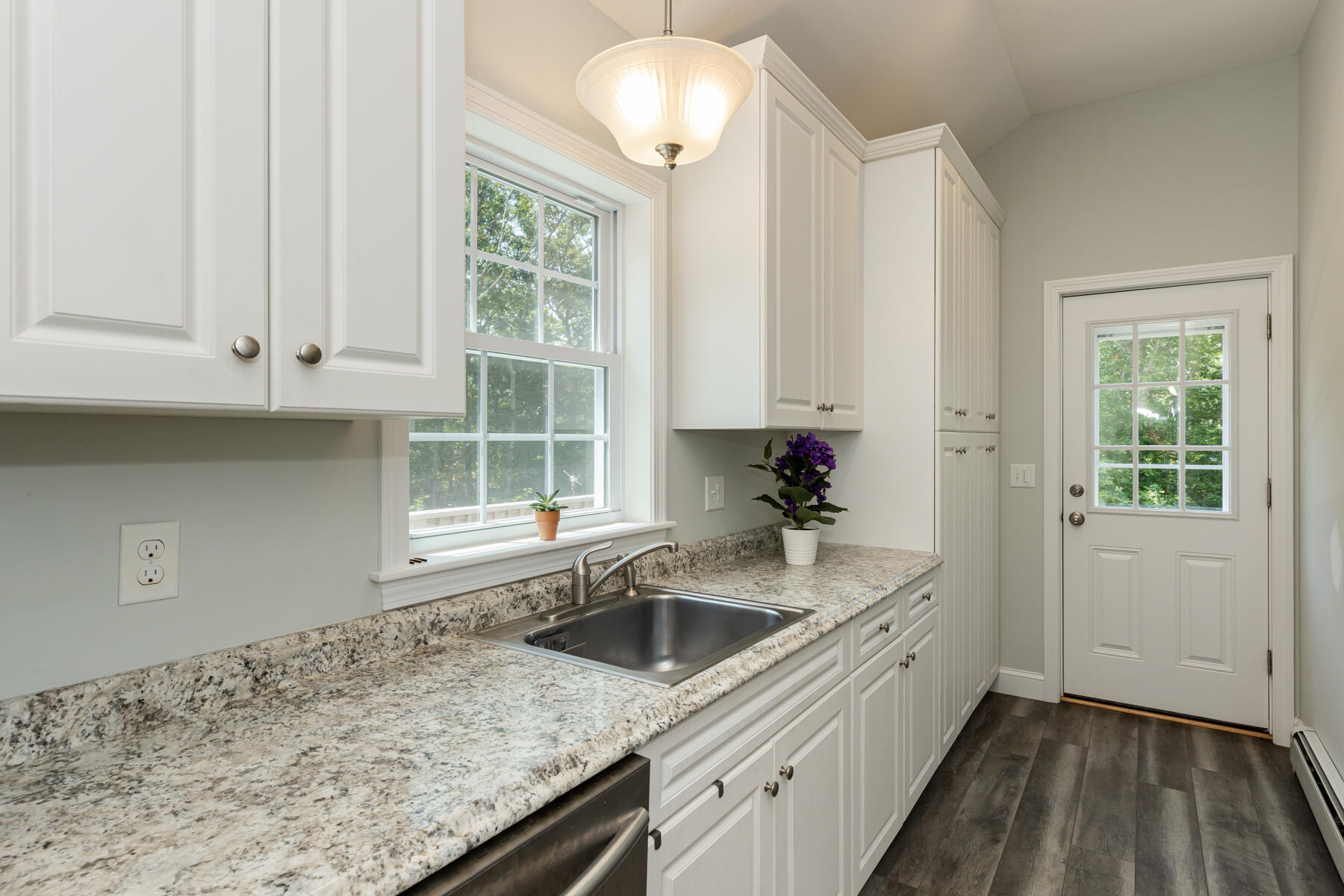 5 Whiffletree Circle Sandwich, MA 02563 - Photo 4 of 33 a kitchen that has a sink and a stove in it