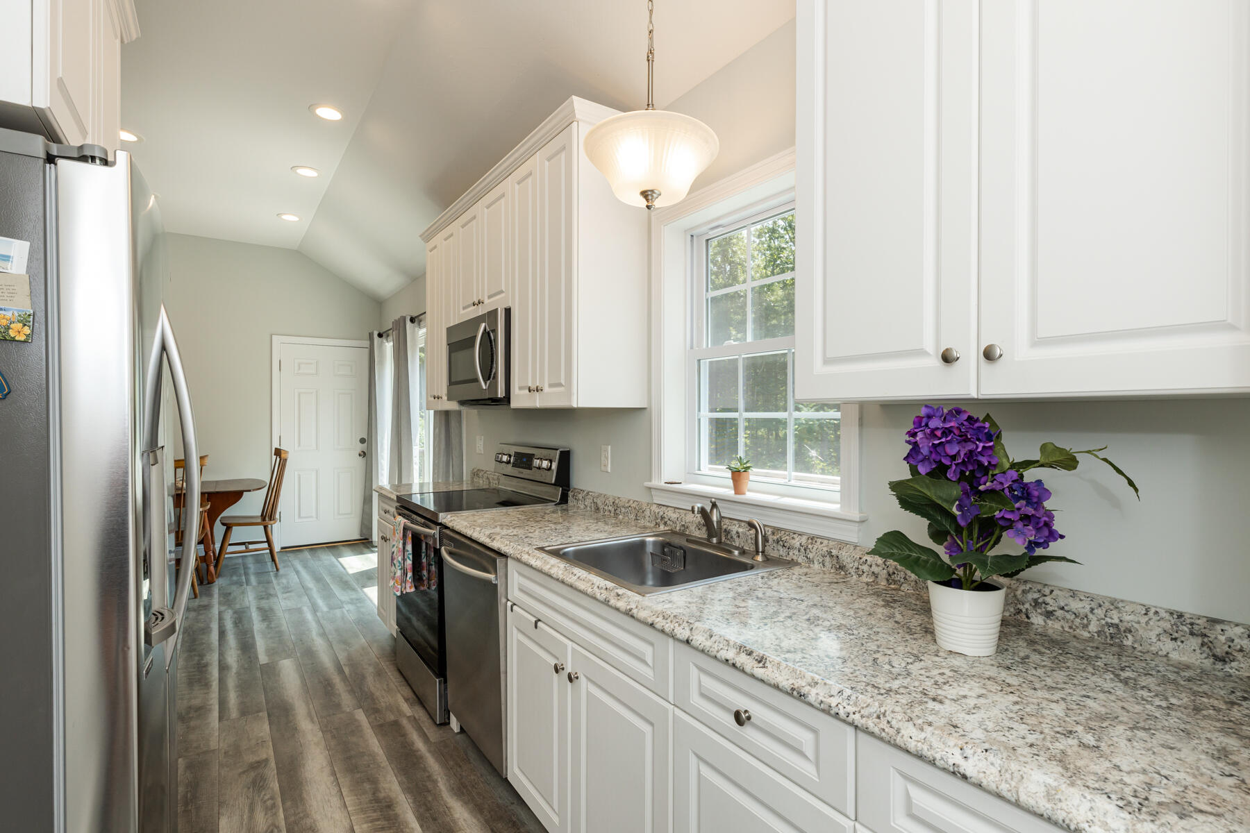 5 Whiffletree Circle Sandwich, MA 02563 - Photo 5 of 33 a kitchen with granite countertop a sink stainless steel appliances and cabinets