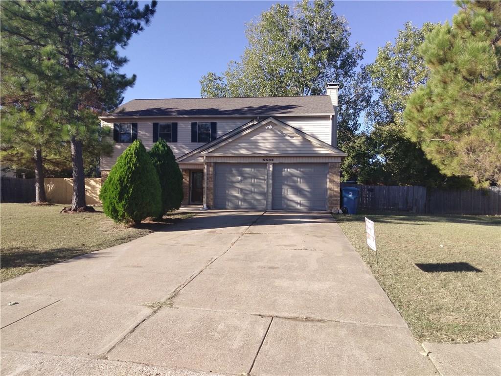 5309 Timber Creek Road Flower Mound, TX 75028 - Photo 1 of 1 a front view of a house with a yard and garage