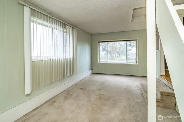 a big room with closet and windows