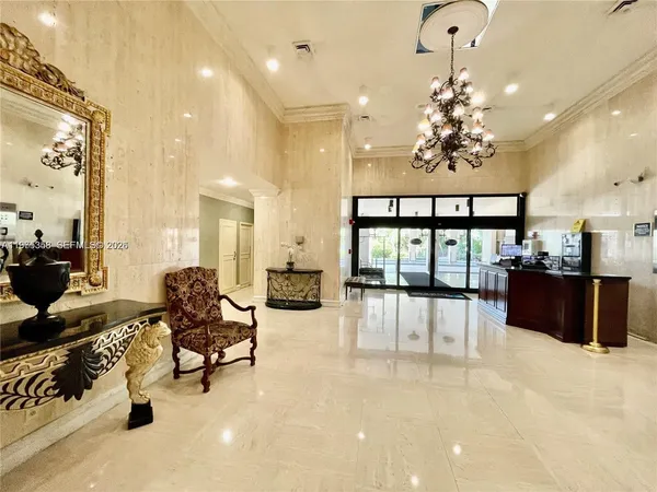 a view of a lobby with furniture and a chandelier