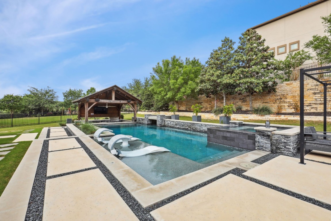 a view of a swimming pool with a patio