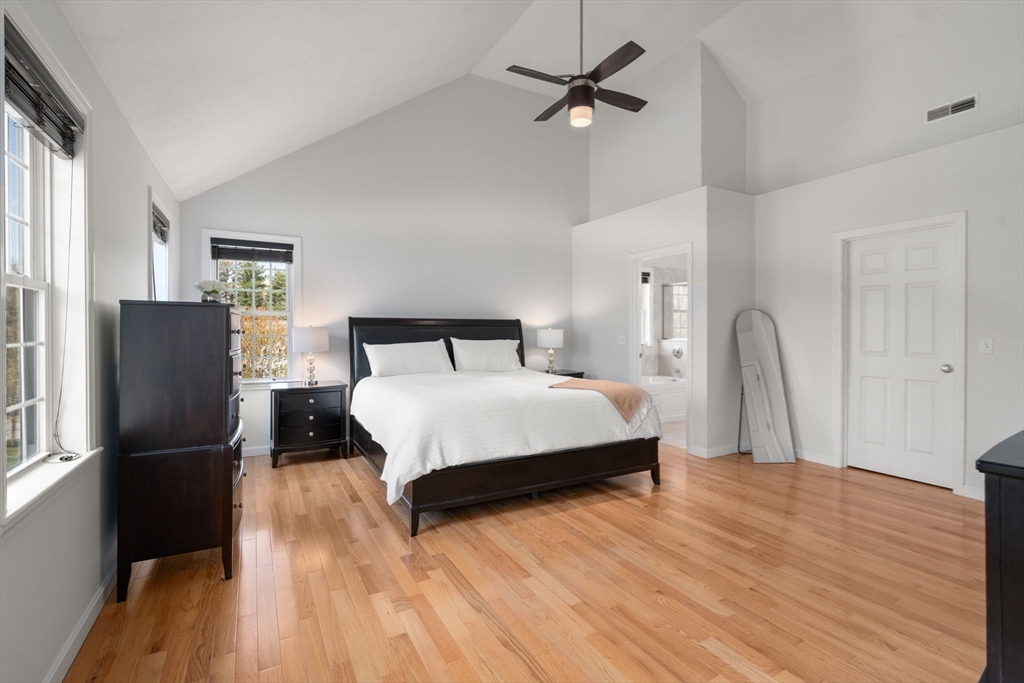 45 Cinnamon Ridge Circle Middleboro, MA 02346 - Photo 20 of 38 a bedroom with a bed and wooden floor