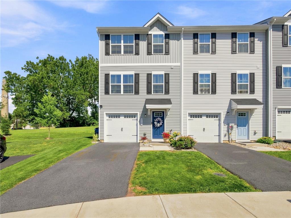2133 Cross Country Road Northampton, PA 18067 - Photo 2 of 44 Crisp vinyl siding and neat shutters define the exterior of this modern multi-level townhouse.