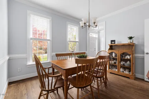 a living room with furniture a rug and a fireplace