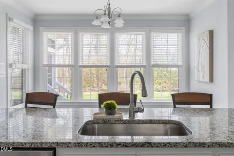 a bedroom with a bed and a ceiling fan