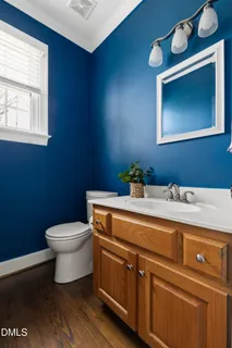 a en suite bathroom with a double vanity sink a mirror and a bathtub