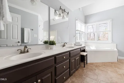 a front view of a house with a yard and a garage