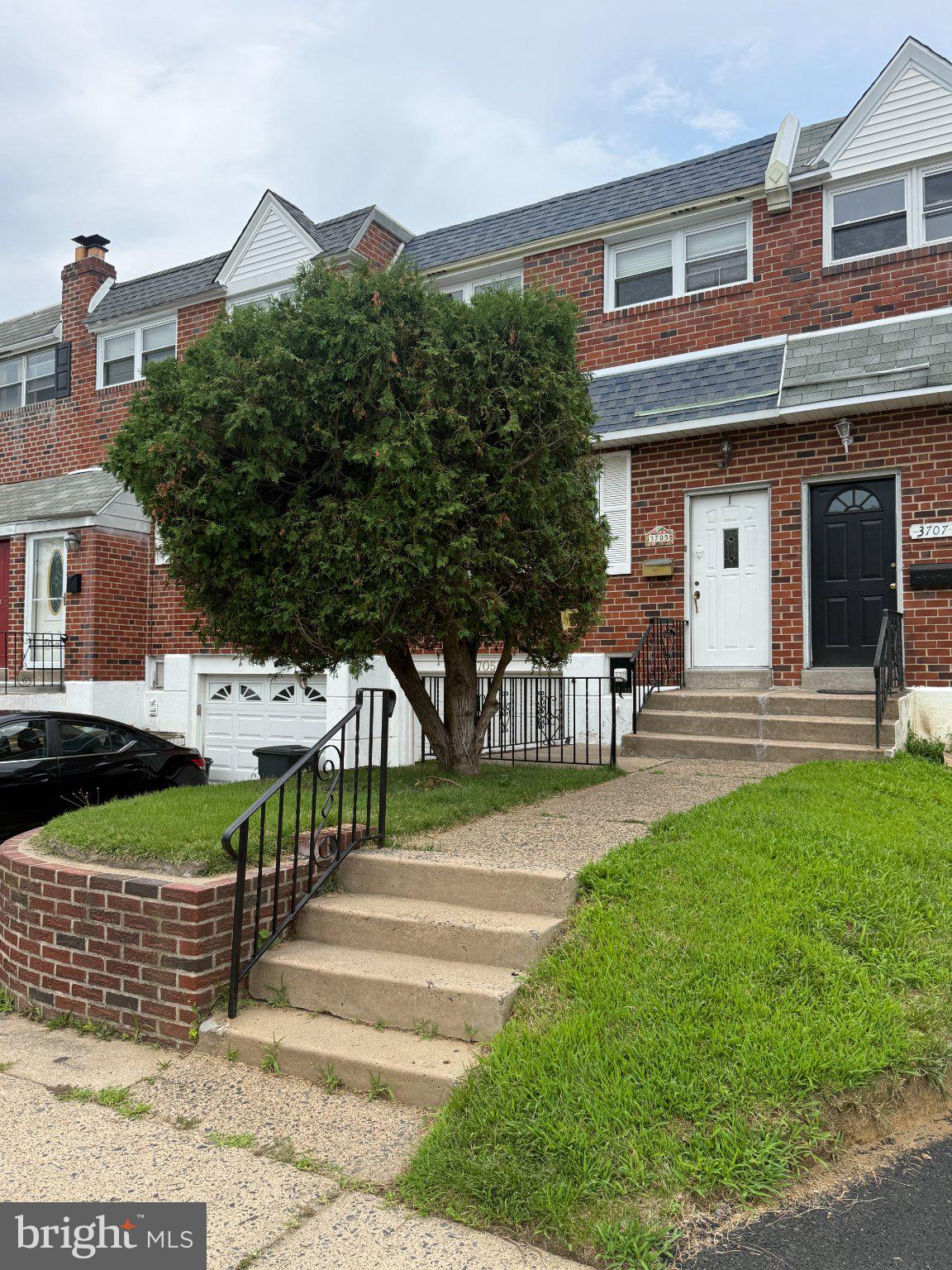 3705 Academy Road Philadelphia, PA 19154 - Photo 2 of 24 Charming brick home with lush greenery.