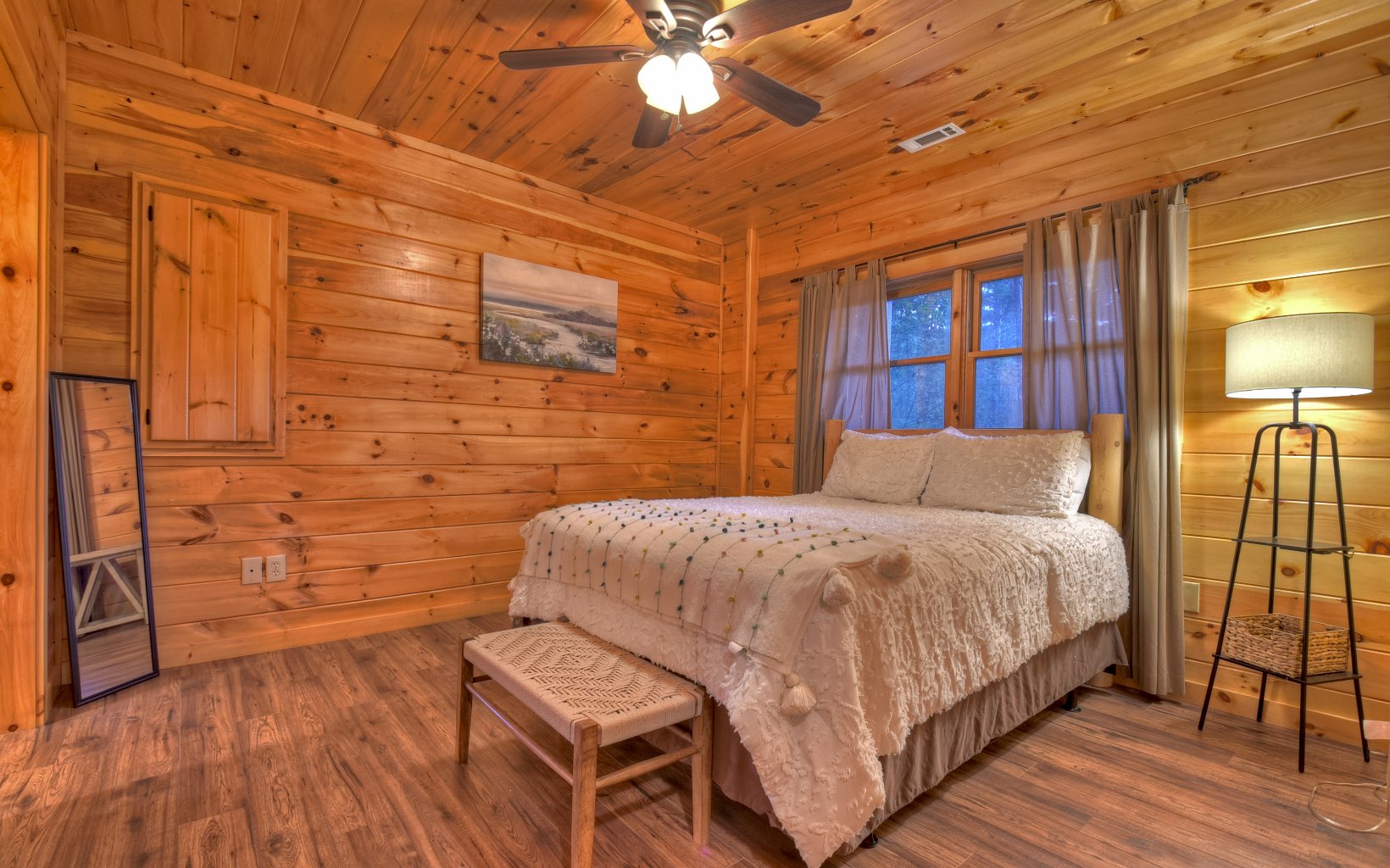 216 The Forest Road Blue Ridge, GA 30513 - Photo 14 of 41 a bedroom with a bed and a flat tv screen on dresser