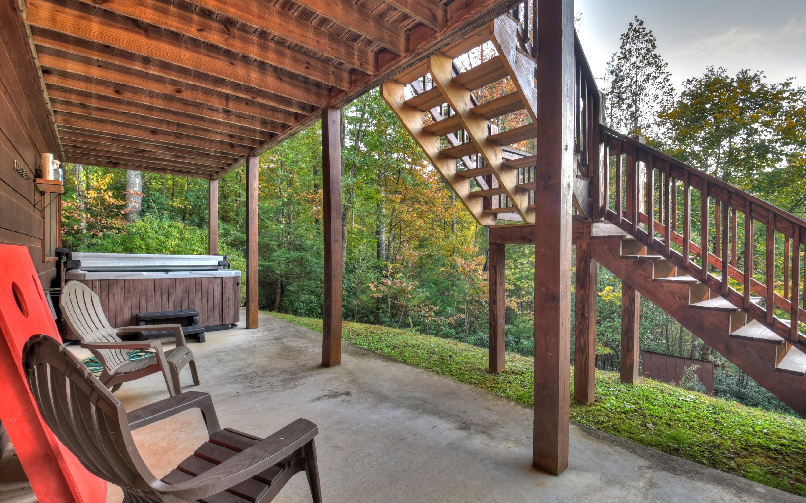 216 The Forest Road Blue Ridge, GA 30513 - Photo 37 of 41 a view of a chair and tables in the patio next to a yard