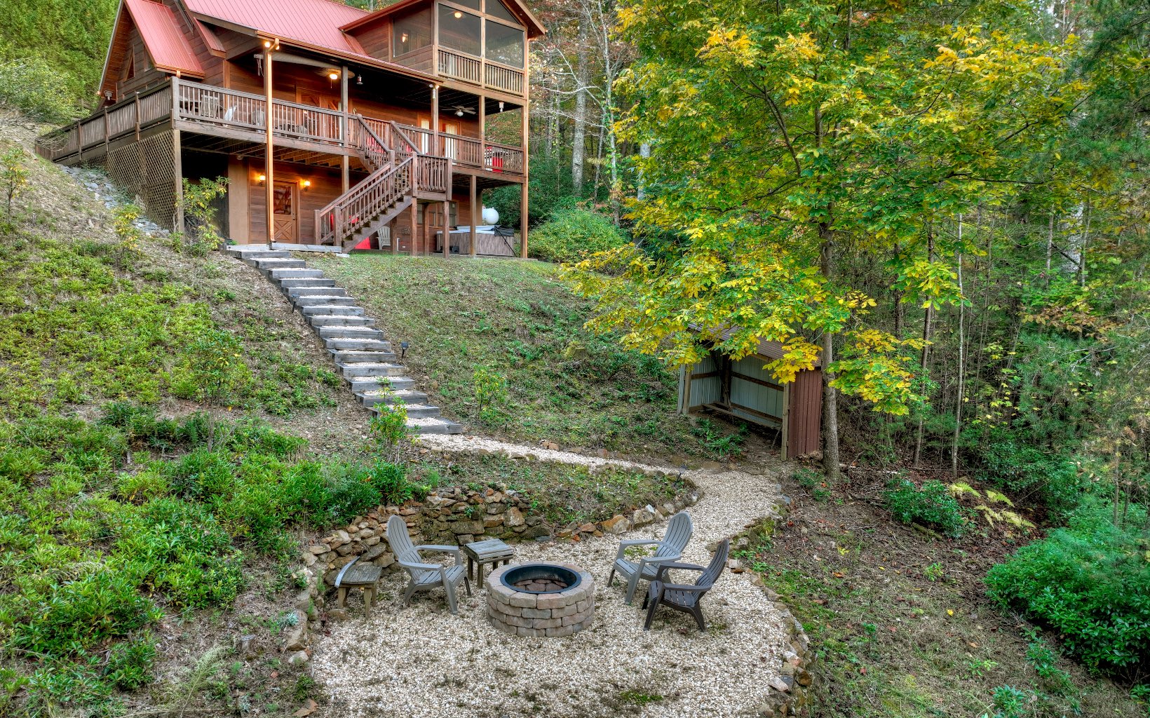 216 The Forest Road Blue Ridge, GA 30513 - Photo 41 of 41 a backyard of a house with yard and outdoor seating