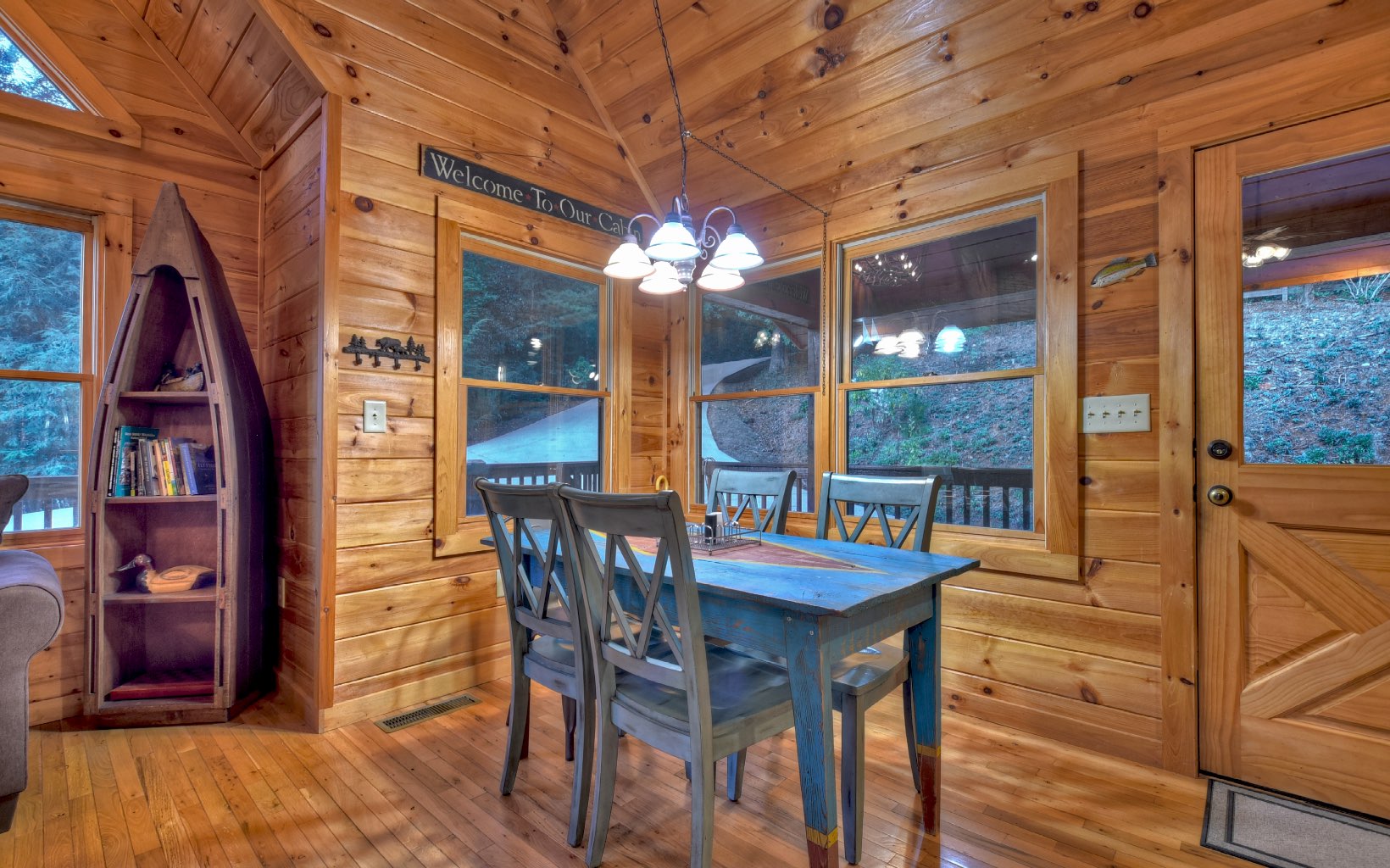 216 The Forest Road Blue Ridge, GA 30513 - Photo 5 of 41 a view of a dining room with furniture and chandelier