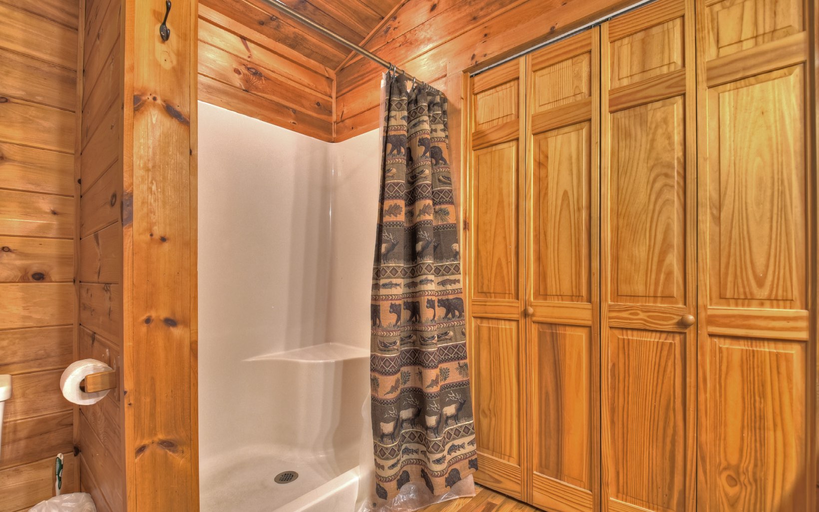216 The Forest Road Blue Ridge, GA 30513 - Photo 10 of 41 a view of a bathroom with a shower and a tub
