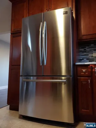 a close view of refrigerator and microwave