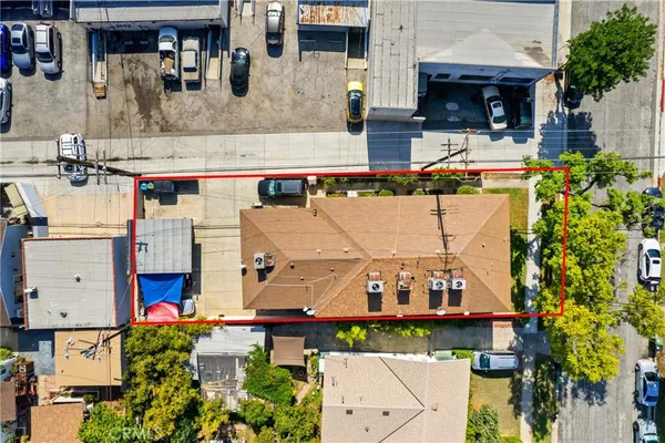 an aerial view of multiple houses with outdoor space