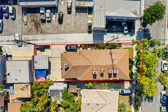 an aerial view of multiple houses with outdoor space