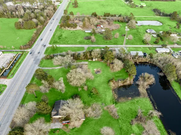 a view of a lake with a yard