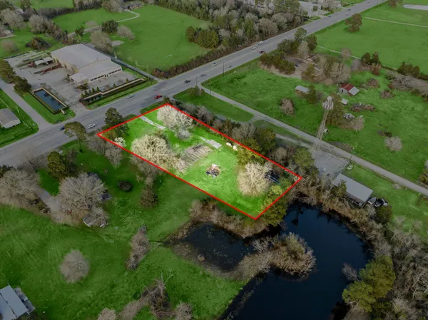 an aerial view of a tennis ground and a swimming pool