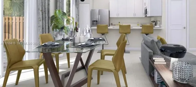 a view of a dining room with furniture and a potted plant