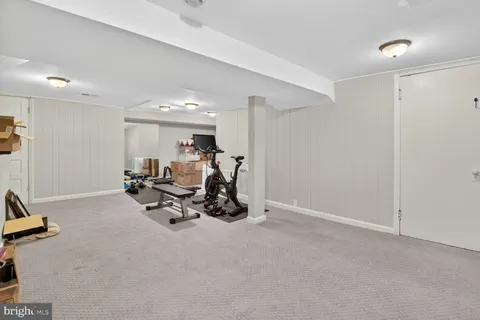 a bathroom with a sink a mirror and shower