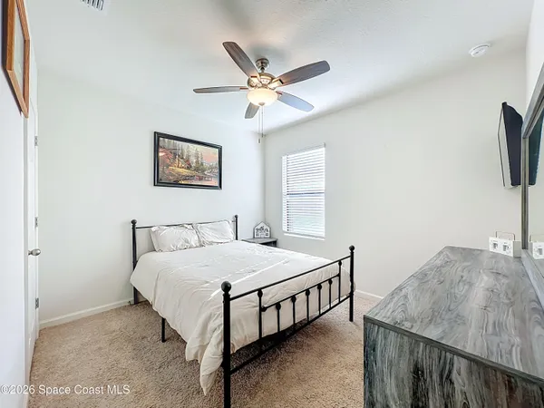 a bedroom with a bed and a table