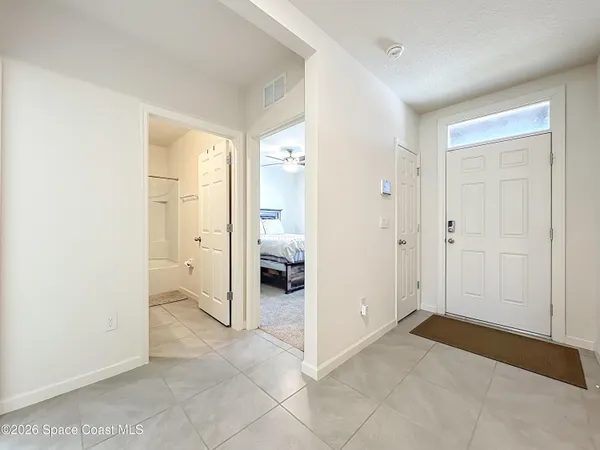 a view of a bathroom with a sink and a mirror