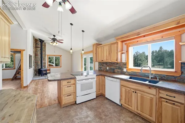 a kitchen with a sink and a window