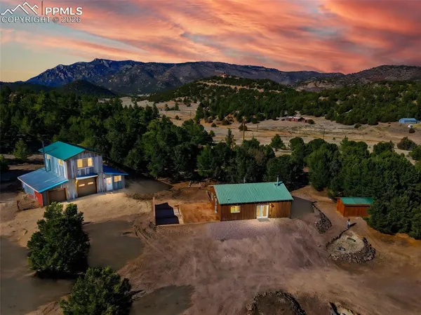 an aerial view of a house with a garden