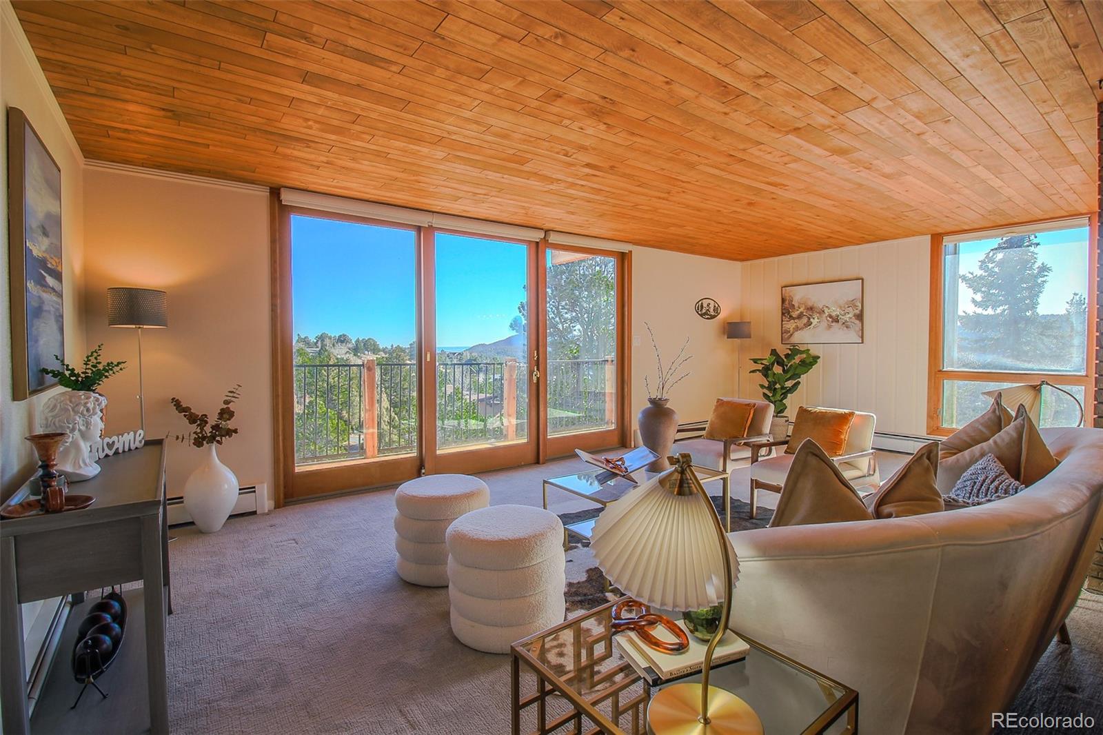 243 Paradise Road Golden, CO 80401 - Photo 13 of 49 a living room with furniture and a large window