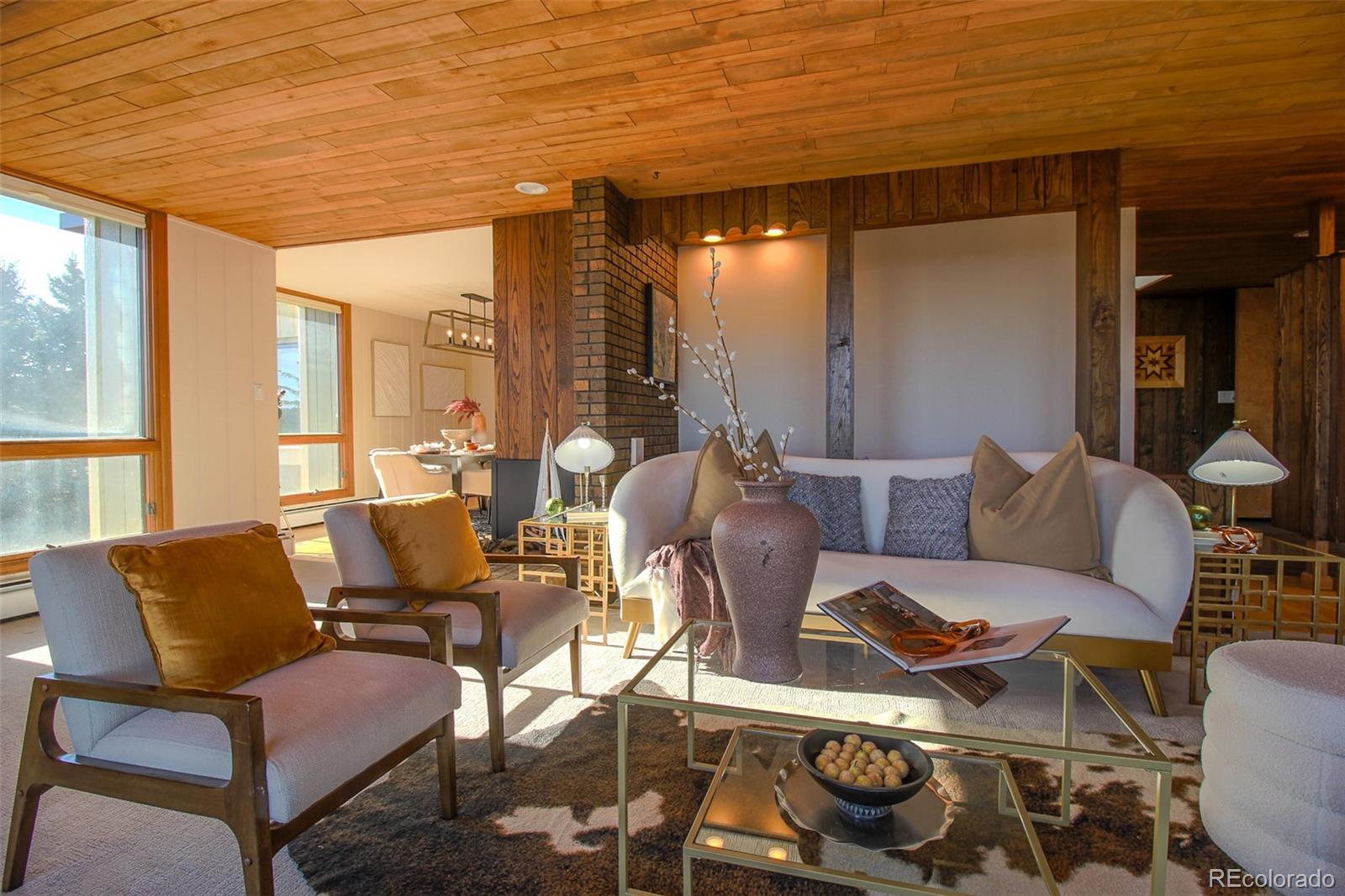 243 Paradise Road Golden, CO 80401 - Photo 14 of 49 a living room with furniture and a floor to ceiling window