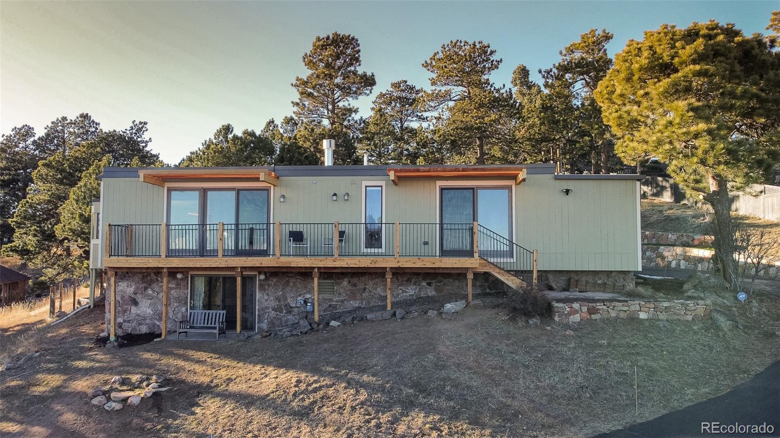 243 Paradise Road Golden, CO 80401 - Photo 2 of 49 aerial view of a house with a yard and hanging chair