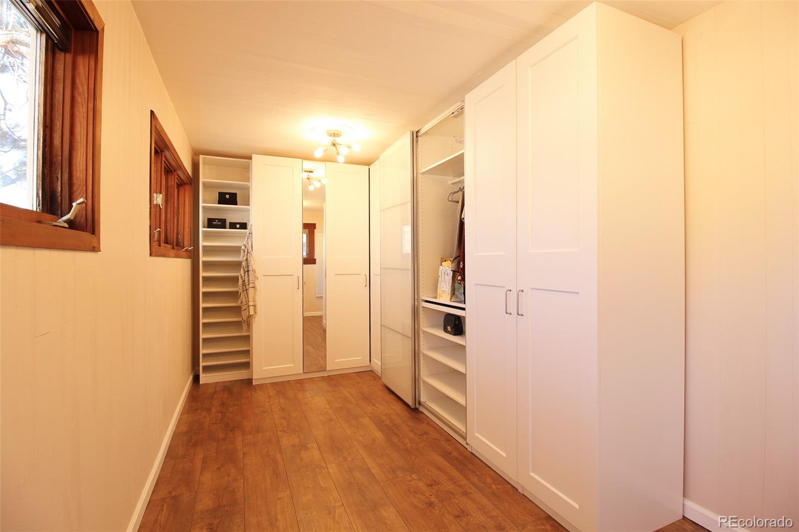 243 Paradise Road Golden, CO 80401 - Photo 24 of 49 a view of a hallway with wooden floor and staircase