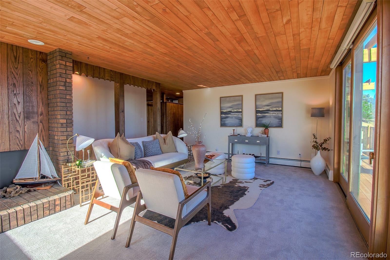 243 Paradise Road Golden, CO 80401 - Photo 26 of 49 a dining room with furniture and a chandelier