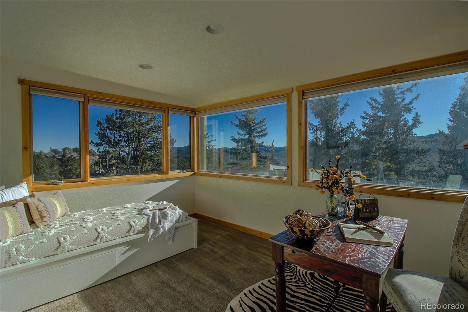 243 Paradise Road Golden, CO 80401 - Photo 35 of 49 a living room with furniture large window and wooden floor