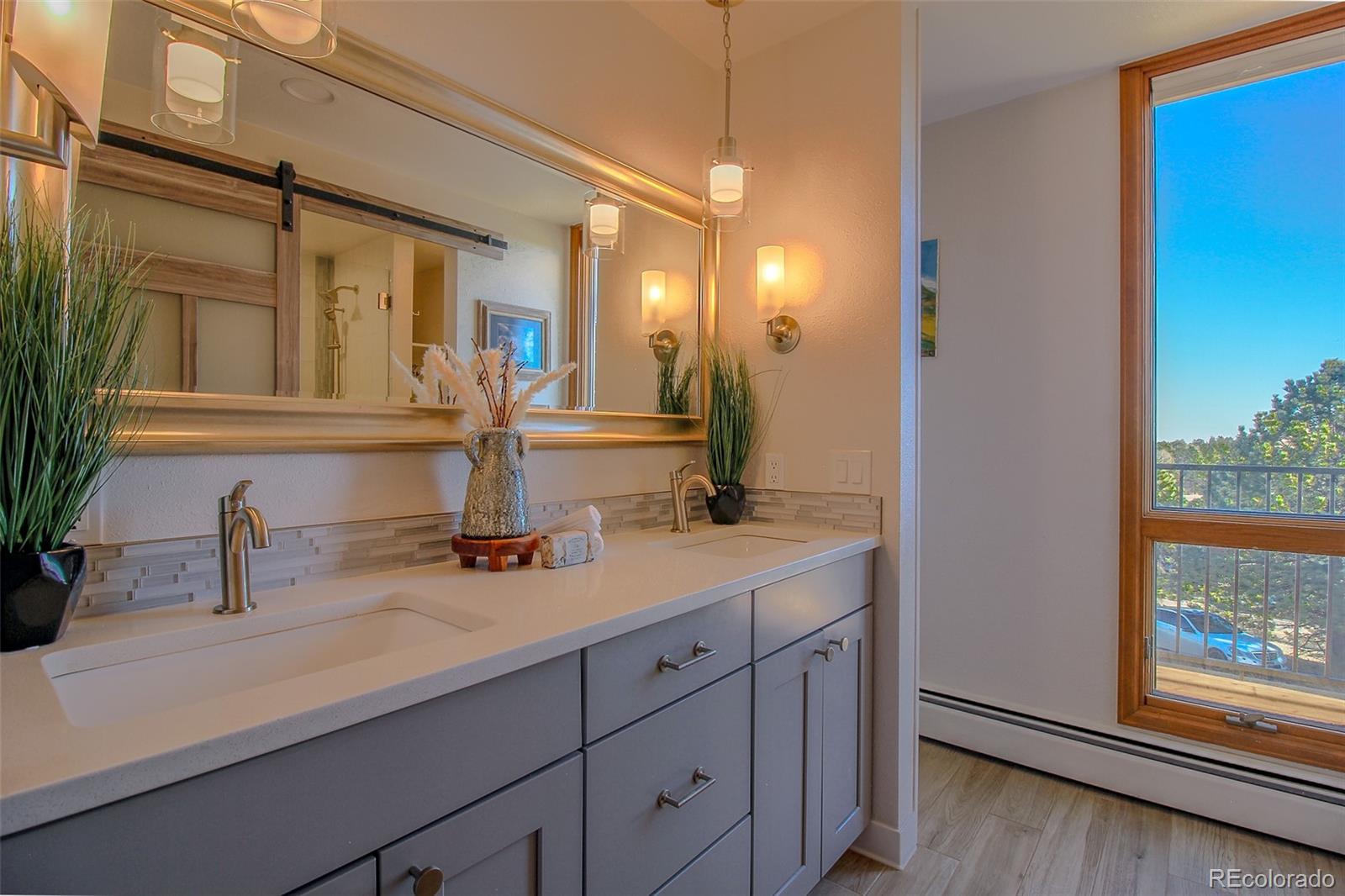 243 Paradise Road Golden, CO 80401 - Photo 6 of 49 a bathroom with a sink and a mirror