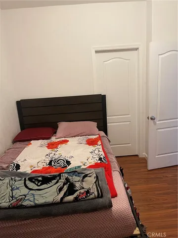 a bedroom with a bed and a fireplace