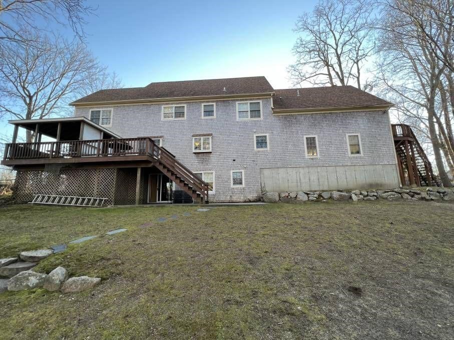 30 Katharine Lee Bates Road Falmouth, MA 02540 - Photo 15 of 15 a front view of a house with a yard