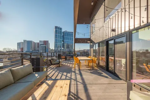 a view of a house with a tree