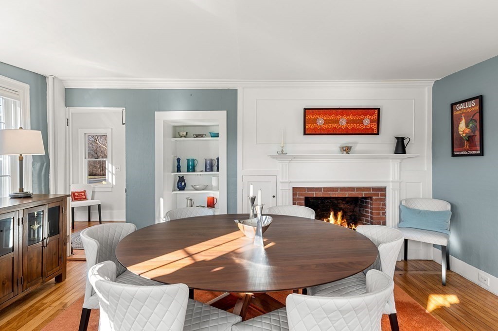 161 High Road Newbury, MA 01951 - Photo 11 of 39 a living room with furniture a table and a fireplace