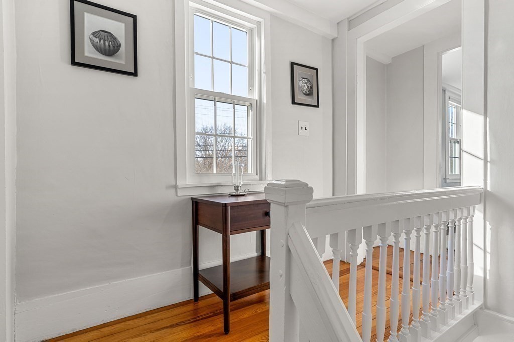 161 High Road Newbury, MA 01951 - Photo 19 of 39 a view of a hallway with wooden floor and a window