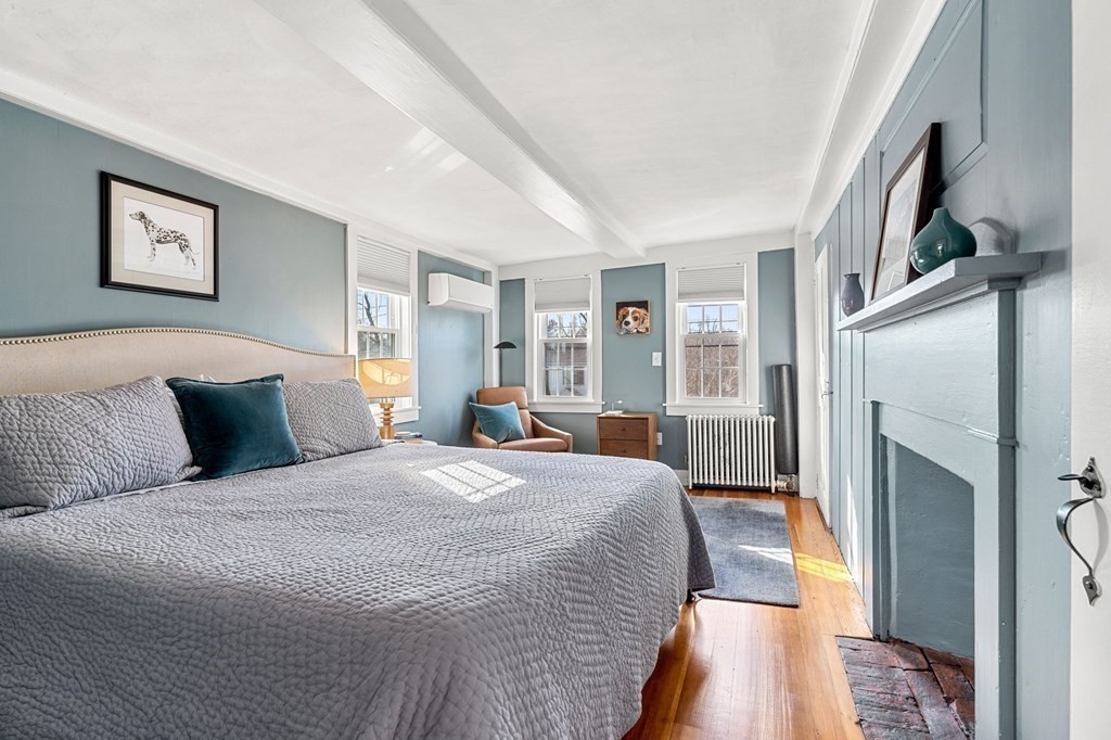 161 High Road Newbury, MA 01951 - Photo 20 of 39 a spacious bedroom with a bed a couch and a window