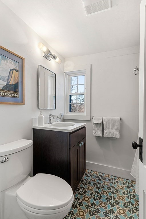 161 High Road Newbury, MA 01951 - Photo 28 of 39 a bathroom with a sink a toilet and mirror